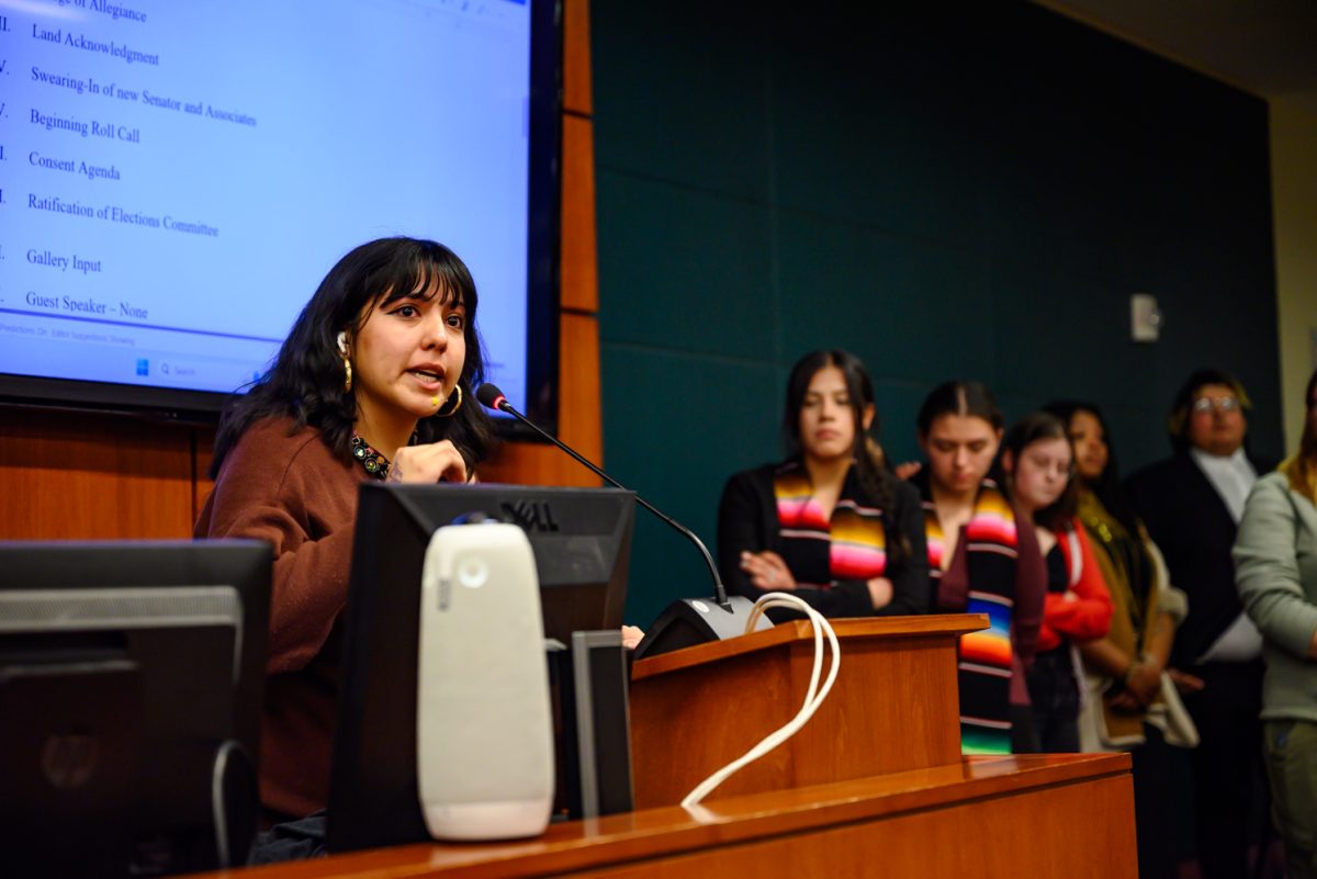 April Gonzalez speaks to the dozens of students gathered in the senate chamber of the Associated Students of Colorado State University Feb. 19. "My family immigrated from Mexico to beat corruption, so I could get an education," she said. "Just to come here to the United States to see the same things that we ran from happening again."