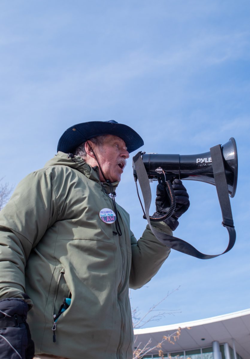 A man using a megaphone.