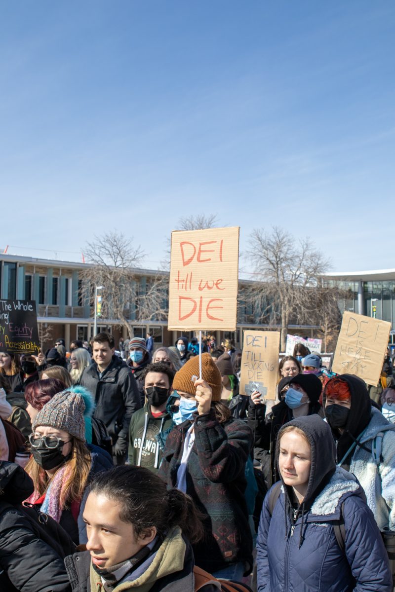 Colorado State University students gather for a diversity, equity, inclusion and accessibility protest that started on the Lory Student Center Plaza Feb. 19. Students and community members gathered with homemade signs on poster boards and spiral notebooks.