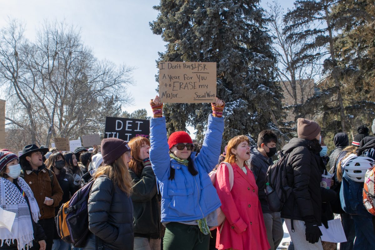 A Colorado State University student holds up a sign during a demonstration in support of diversity, equity, inclusion and accessibility, organized by CSU students Wednesday, Feb. 19.