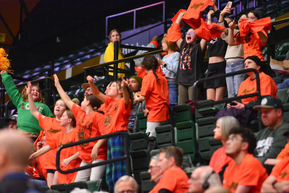 A group of young girls celebrating in the crowd during the Colorado State University’s Women’s basketball teams game Feb. 19. The crowd was repping the orange color during CSU’s Aggies game.