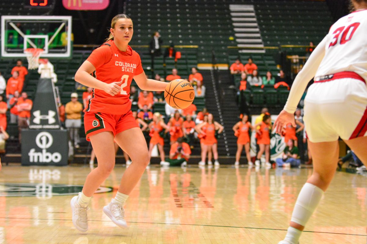 Brooke Carlson during a play against the Fresno State Bulldogs Feb. 19. This was during the teams Aggie game where they represent CSU’s past by wearing orange.