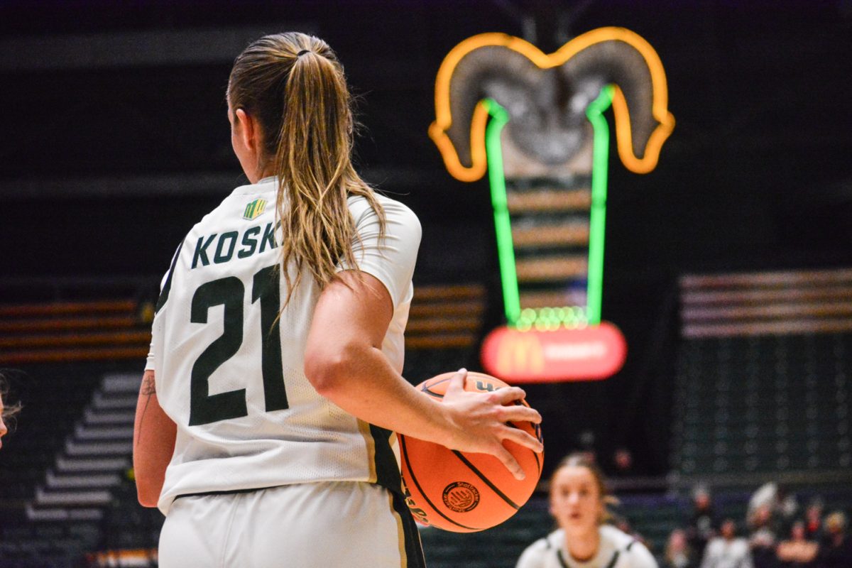 Emma Ronsiek (#21) looking to her teammates deciding the next play Feb. 1. Emma and her teammates wore jerseys with cancer survivors' last names to raise cancer awareness.