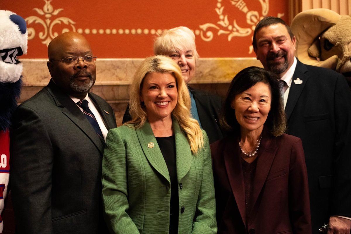 Colorado State University President Amy Parsons, CSU Pueblo Interim President Rico Munn, CSU System Chancellor Tony Frank, CSU Global President Becky Takeda-Tinker and Senator Cathy Kipp pose for a photo on the Colorado Senate floor. Kipp, a senator from Fort Collins, led the recognition of CSU's Founder's Day for the Senate. 