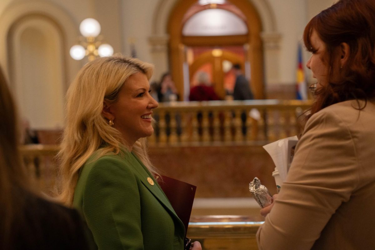 Colorado State University President Amy Parsons interacts with CSU legislative interns at the Colorado Capitol Feb. 11. Political science students have the opportunity to intern during the legislative session each spring. 