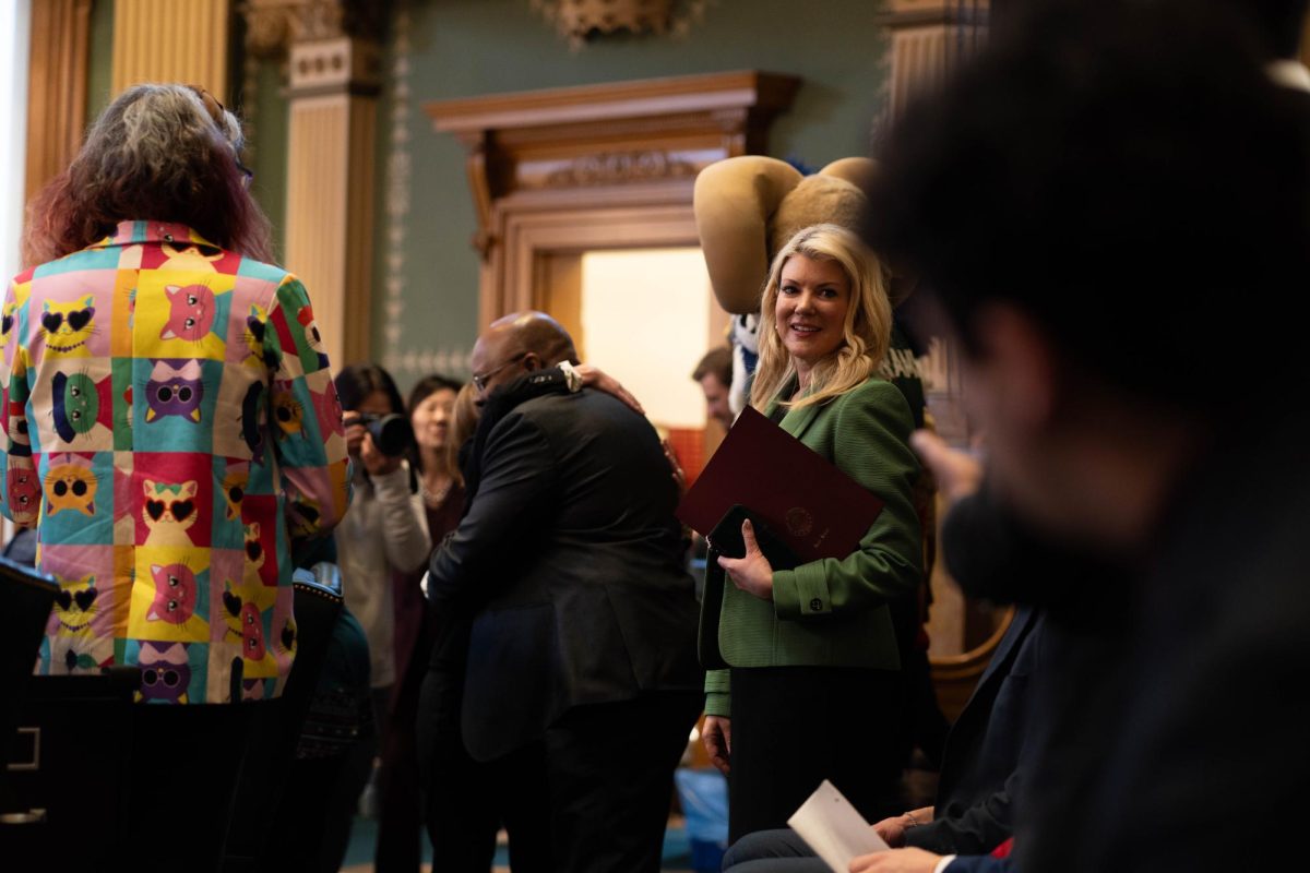 Colored State University President Amy Parsons greets various state representatives on the House floor Feb. 11. CSU engaged with both members of the House and Senate for Founder's Day.  