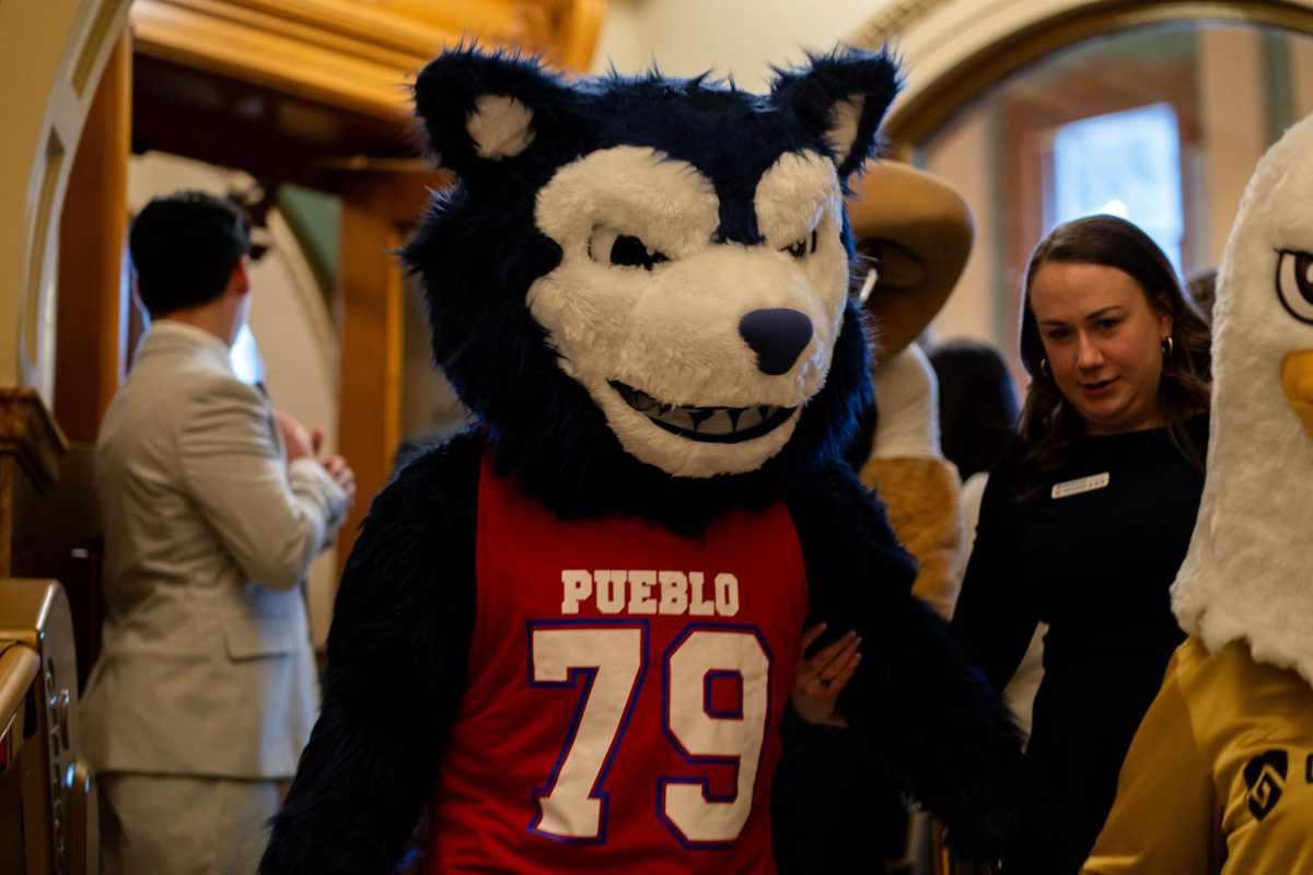 Wolfie the ThunderWolf, CSU Pueblo's mascot leaves the House of Representatives floor on Feb. 11. Wolfie and other CSU system mascots were present for Founder's Day. 