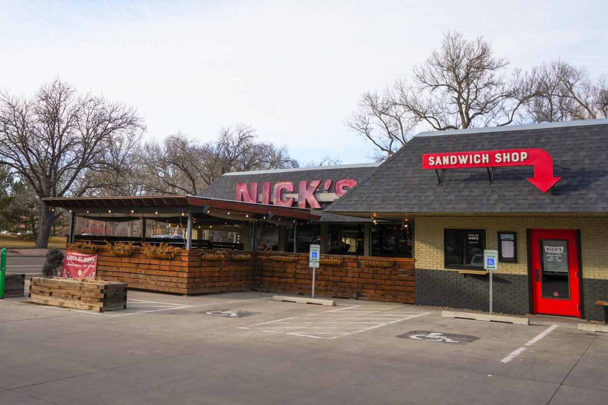 A restaurant reading "Nick's" sits on the side of the road.