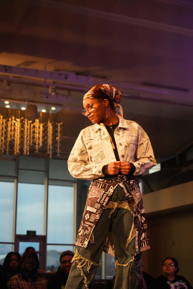 A model strikes a pose on a runway.