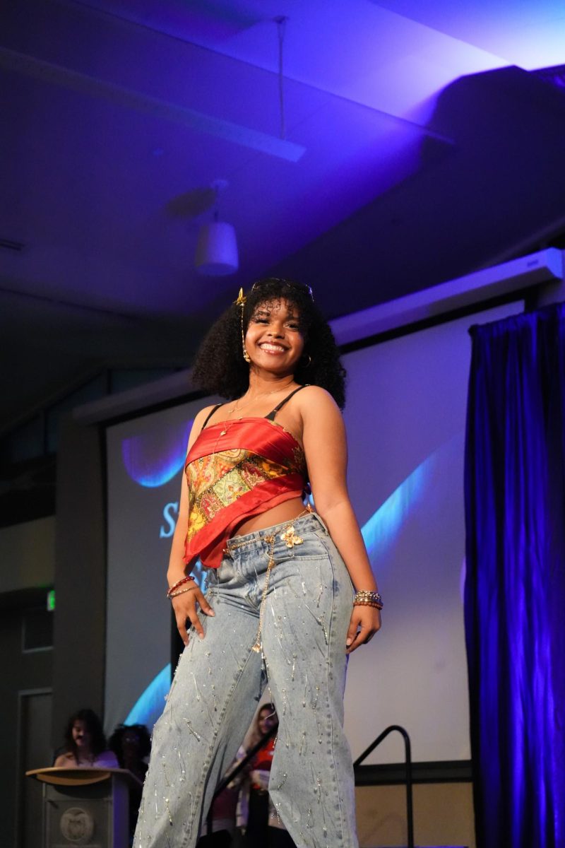 A model strikes a pose on a runway.