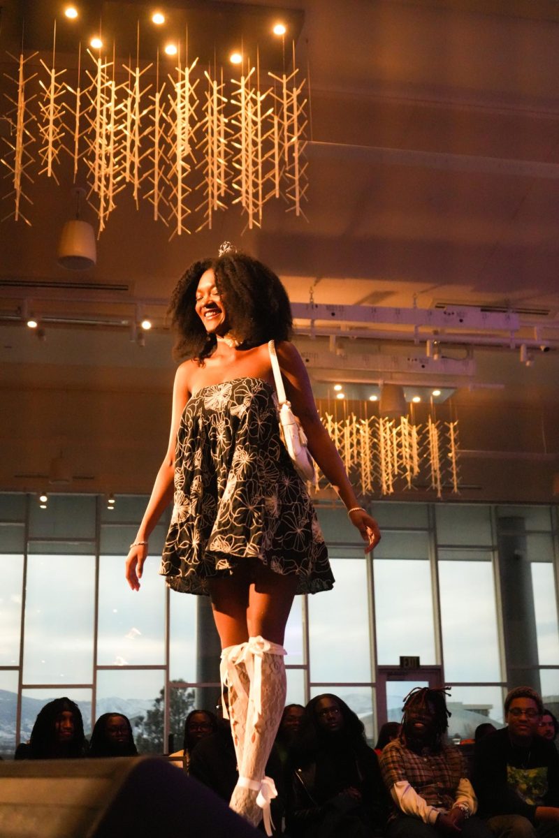 Student Lashay St. Fort walks the runway at the Threads of Tradition fashion show, one of many events put on by the Black/African American Cultural Center celebrating Black History Month. Feb 12, 2025. 