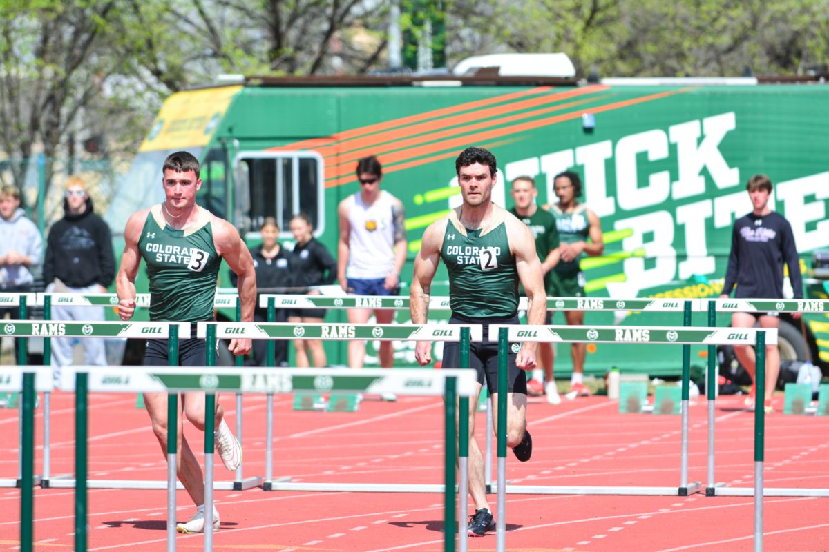 Zach Sell and Elijah Scott running during their hurdles event March 29. These two athletes performed at the Jack Christiansen Memorial event.