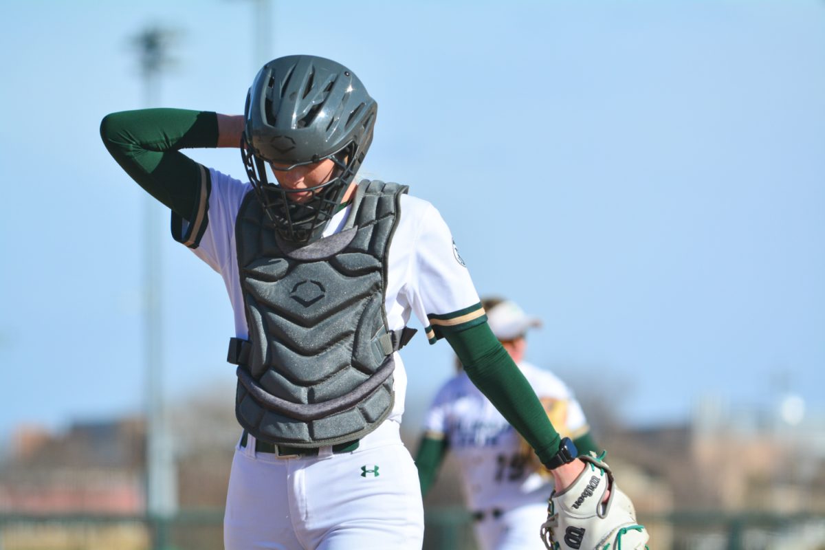Brooke Bohlender walking back to the home base to be a catcher March 15. Brooke was the main catcher against UNLV..