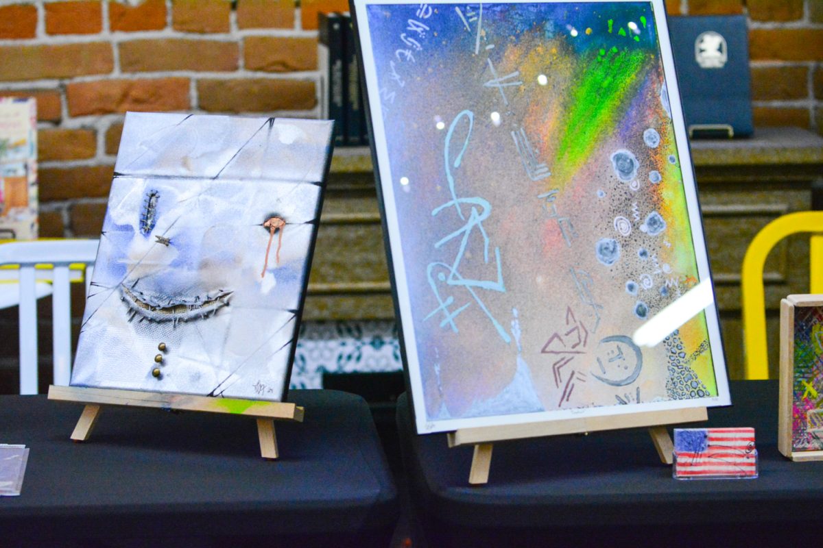 Two pieces of art during the art walk representing local artists March 8. This art walk was in old town Fort Collins at a Book store.