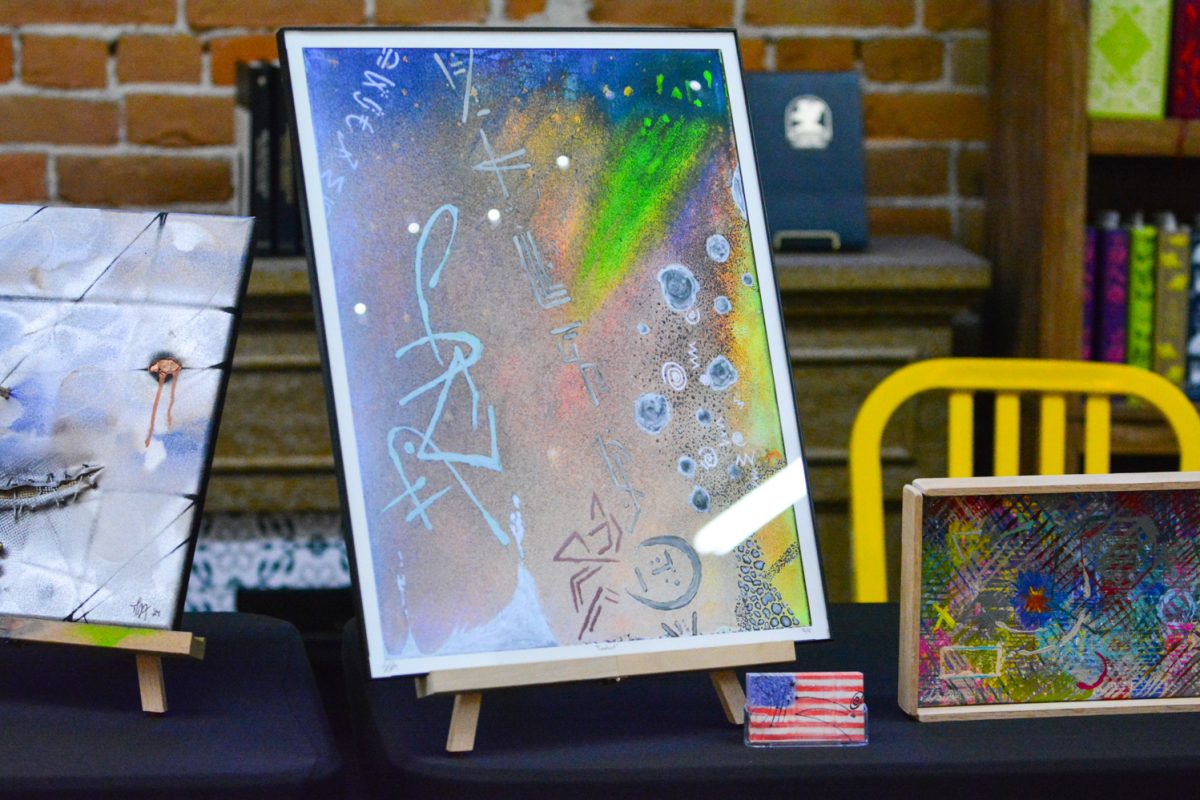 A series of three artworks created by local Fort Collins artists sit on a table for display March 7. These works were part of Fort Collins' First Friday Art Walk, a monthly, self-guided tour across downtown Fort Collins that showcases local artistic talent.