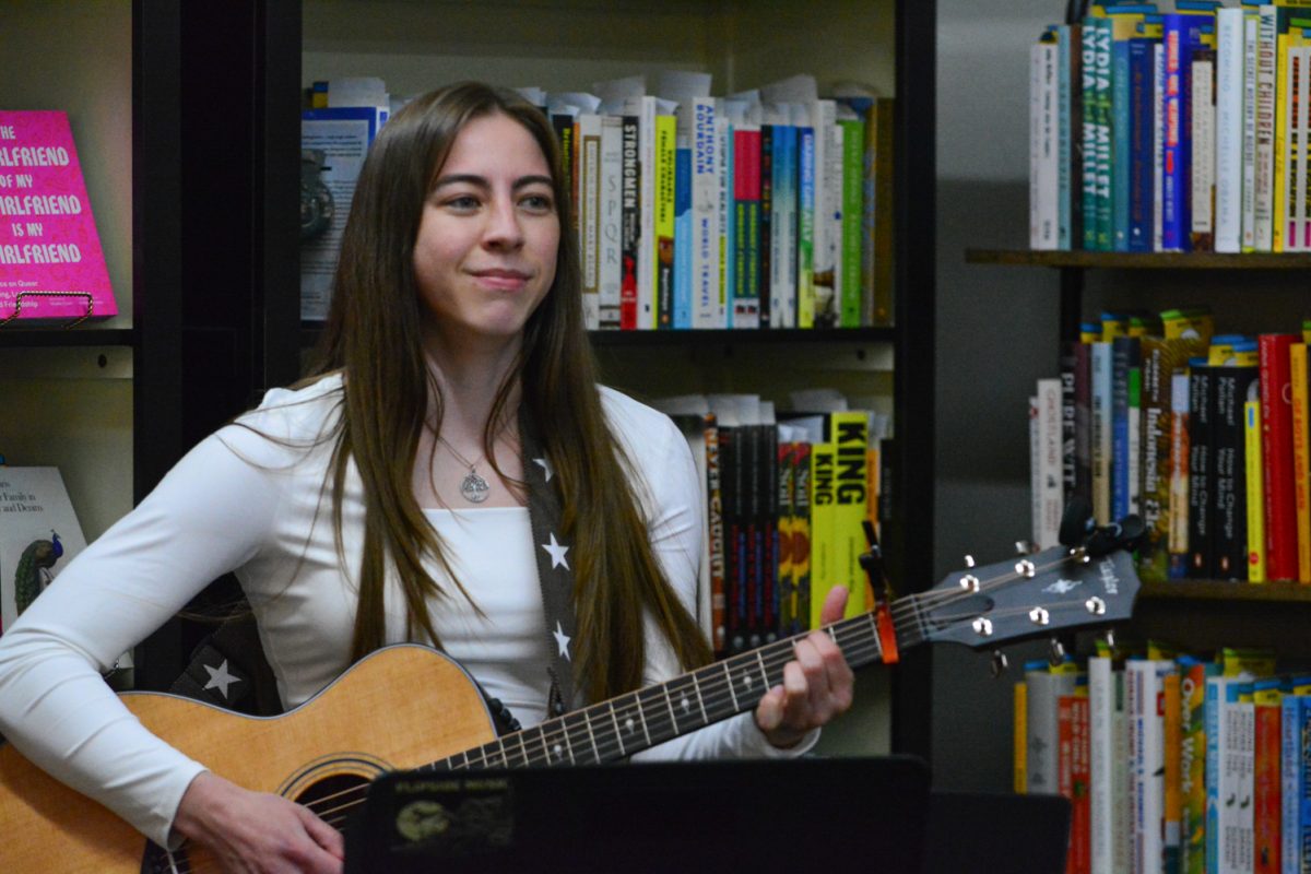 Musician Bailey Mae singing during an art walk March 8. She sang in old town Fort Collins.