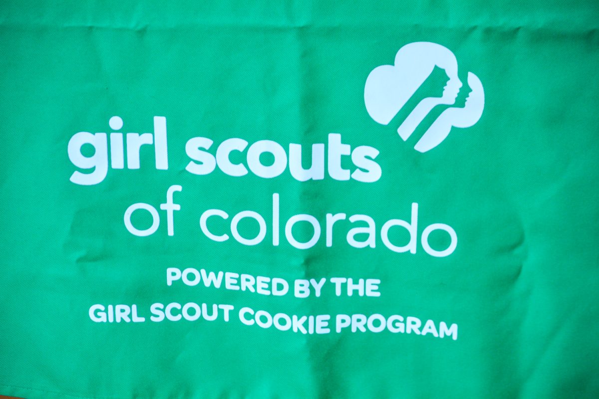 Girl Scouts of Colorado logo on the table where the cookies are being sold Feb. 25. Girl Scouts are a club where young girls across America learns life lessons by selling these cookies.