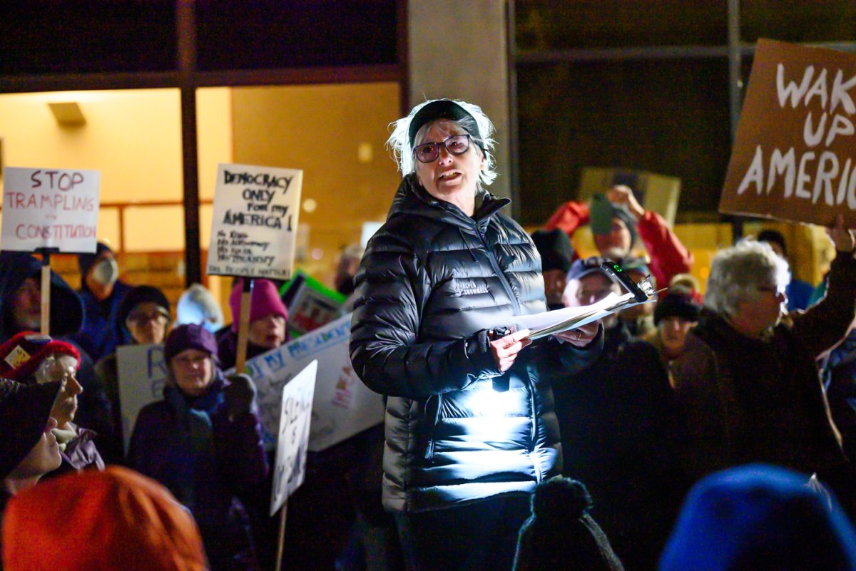 Evelyn Jacobi speaks to a crowd of protesters outside the Fort Collins Post Office March 4. As a former member of the League of Women Voters who is still in contact with the group, she came to be with the community and offered to speak. "When you are with people who are willing to stand up and take a stand for what is right, for our democracy, for diversity, for all the values that we hold dear, it's energizing to see people here," Jacobi said.