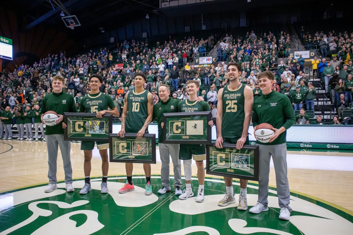 Colorado State University men's basketball seniors Jalen Lake (15), Nique Clifford (10), Bowen Born (13), and Ethan Morton (25) pose for a photo before the game against San Jose State March 4. CSU won 83-56.