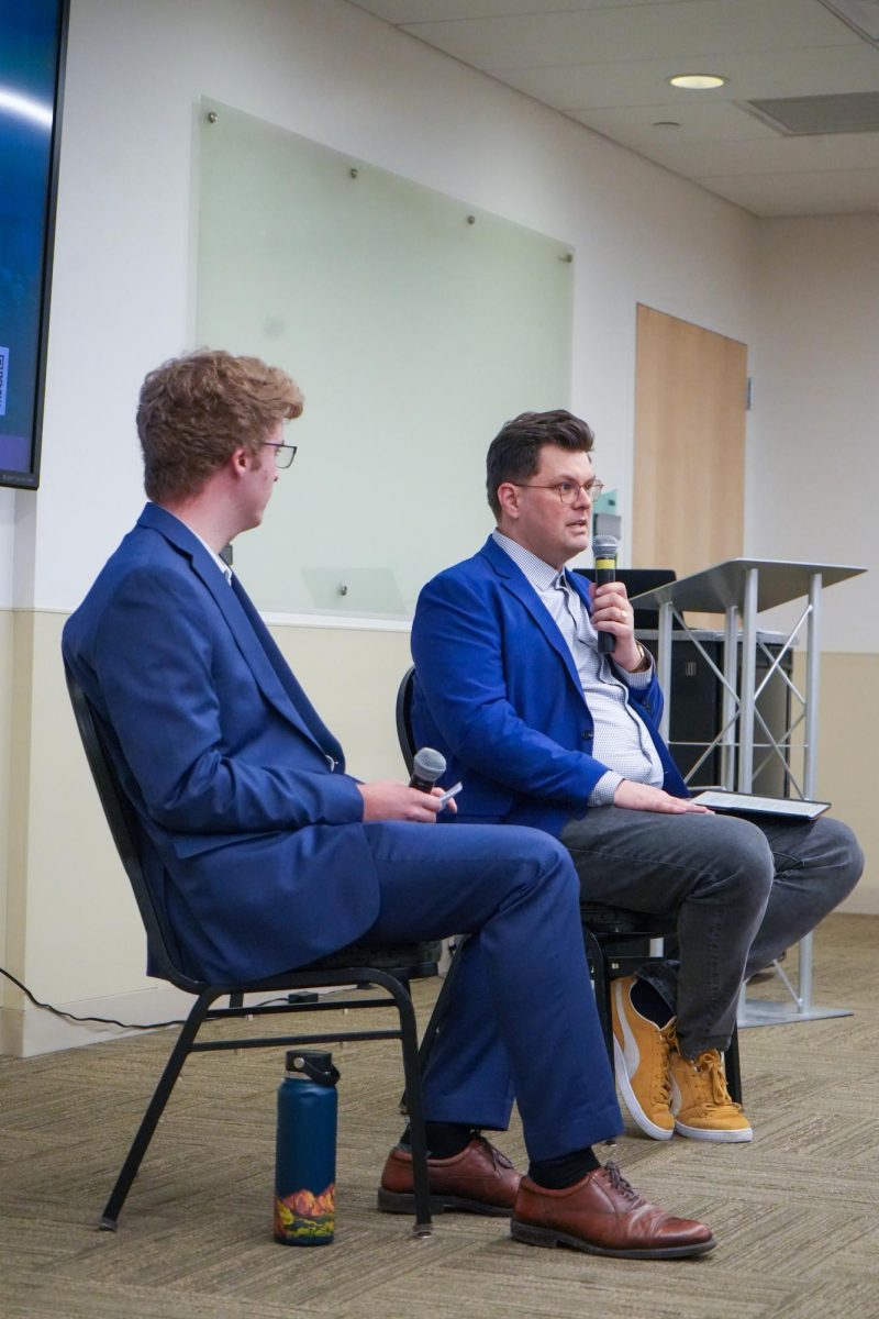 Speaker Dr. Dominic Stetula and student moderator Ethan Guinness address attendees at one of Colorado State's many 2025 Democracy Summit events titled "Code vs. Consequence: The Tech & Policy Debate on Misinformation and Social Media." March 7, 2025.
