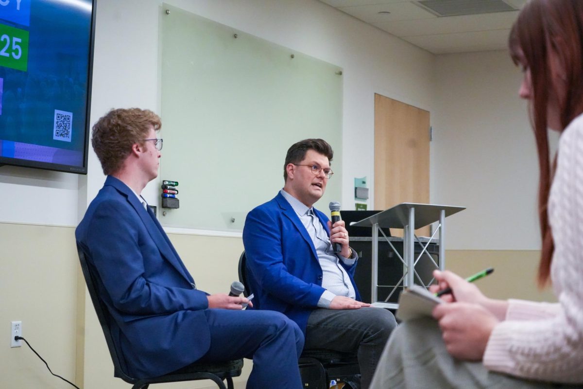 Speaker Dr. Dominic Stetula and student moderator Ethan Guinness address attendees at one of Colorado State's many 2025 Democracy Summit events titled "Code vs. Consequence: The Tech & Policy Debate on Misinformation and Social Media." March 7, 2025.