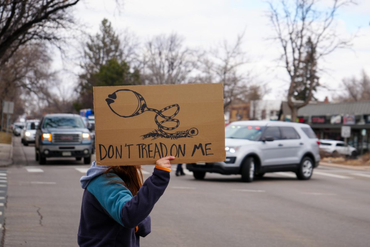 Students and other protesters temporarily stop traffic on College Avenue while marching in the Stand Up for Science protest March 7. 