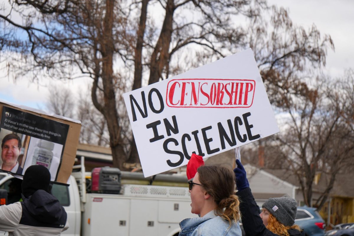 Image of a protester holding up a sign.