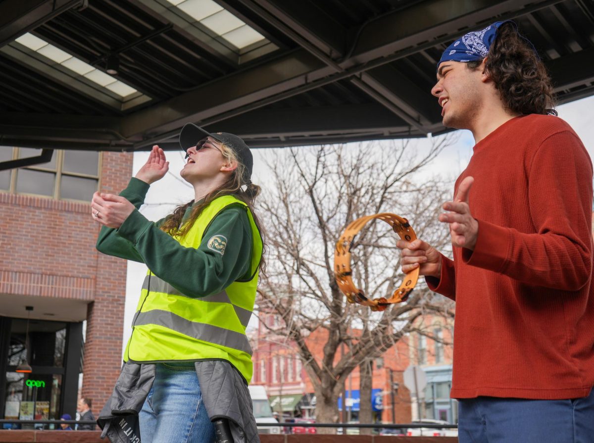 Leo Tyer and Nico Diarte lead a chant at the "Stand up for Science" demonstration in Old Town Square on March 7 2025. 