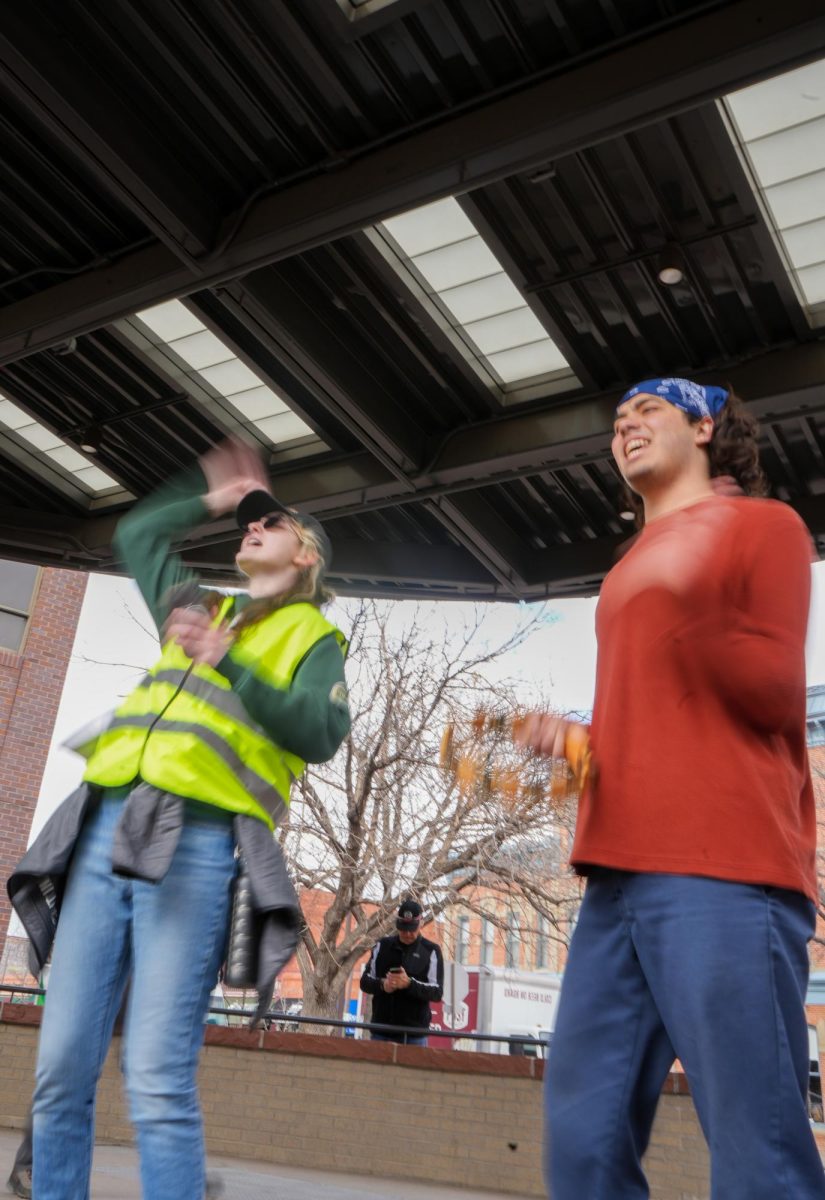 Leo Tyer and Nico Diarte lead a chant at the "Stand up for Science" demonstration in Old Town Square on March 7 2025. 