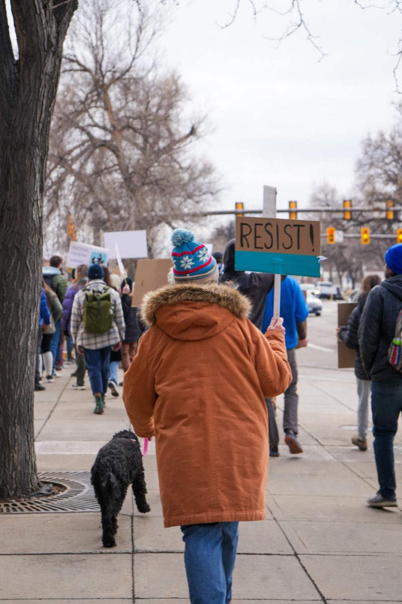 A protestor holds up a sign simply reading, "Resist," during the march in support of the nationwide "Stand up for Science" movement on March 7, 2025. 