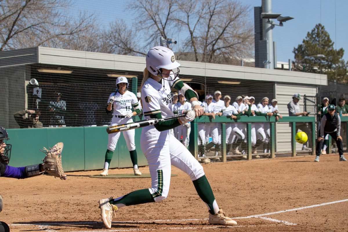 Brooke Bohlender (8) hits the ball at the first softball game in a doubleheader against Weber State March 8. CSU won, 11-7. 