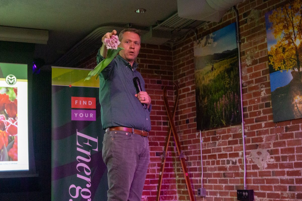 Chad Miller, associate professor at Colorado State University, begins his talk, "Tiptoeing Through the Tulips: Exploring a Colorful History," at the Fort Collins Welcome Center March 12. In 1636, tulip prices rose quickly and then plummeted the next year, demonstrating a market trend known as "tulip mania," Miller explained.