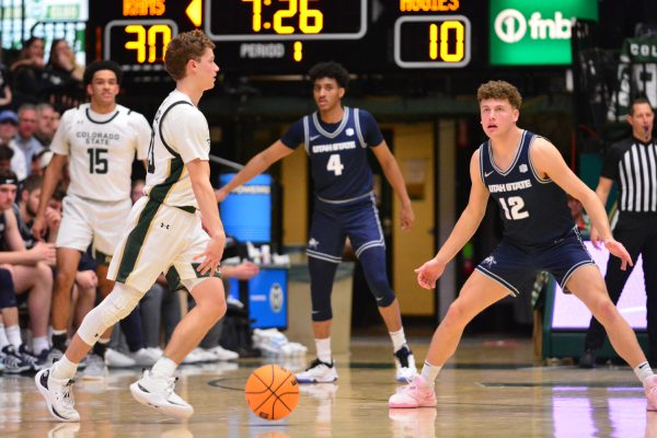 Bowen Born dribbles the ball during a play during Colorado State University's game against Utah State March 1. Bowen and his teammates defeated USU 93-66.