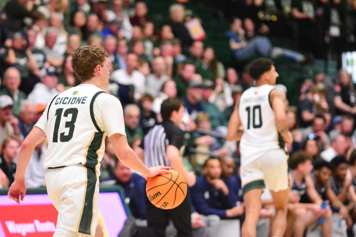 Bowen Born dribbling the ball down the court to make a play March 1. Bowen and his teammates displayed incredible teamwork during their game against Utah State.