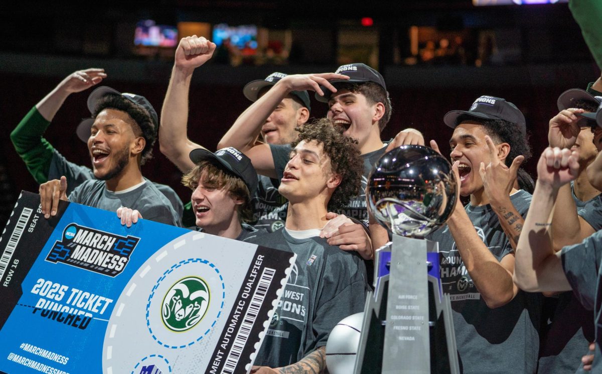 Colorado State University's men's basketball members celebrate with the Mountain West trophy and punched ticket to the NCAA tournament following their championship win against Boise State March 15. CSU won 69-56.