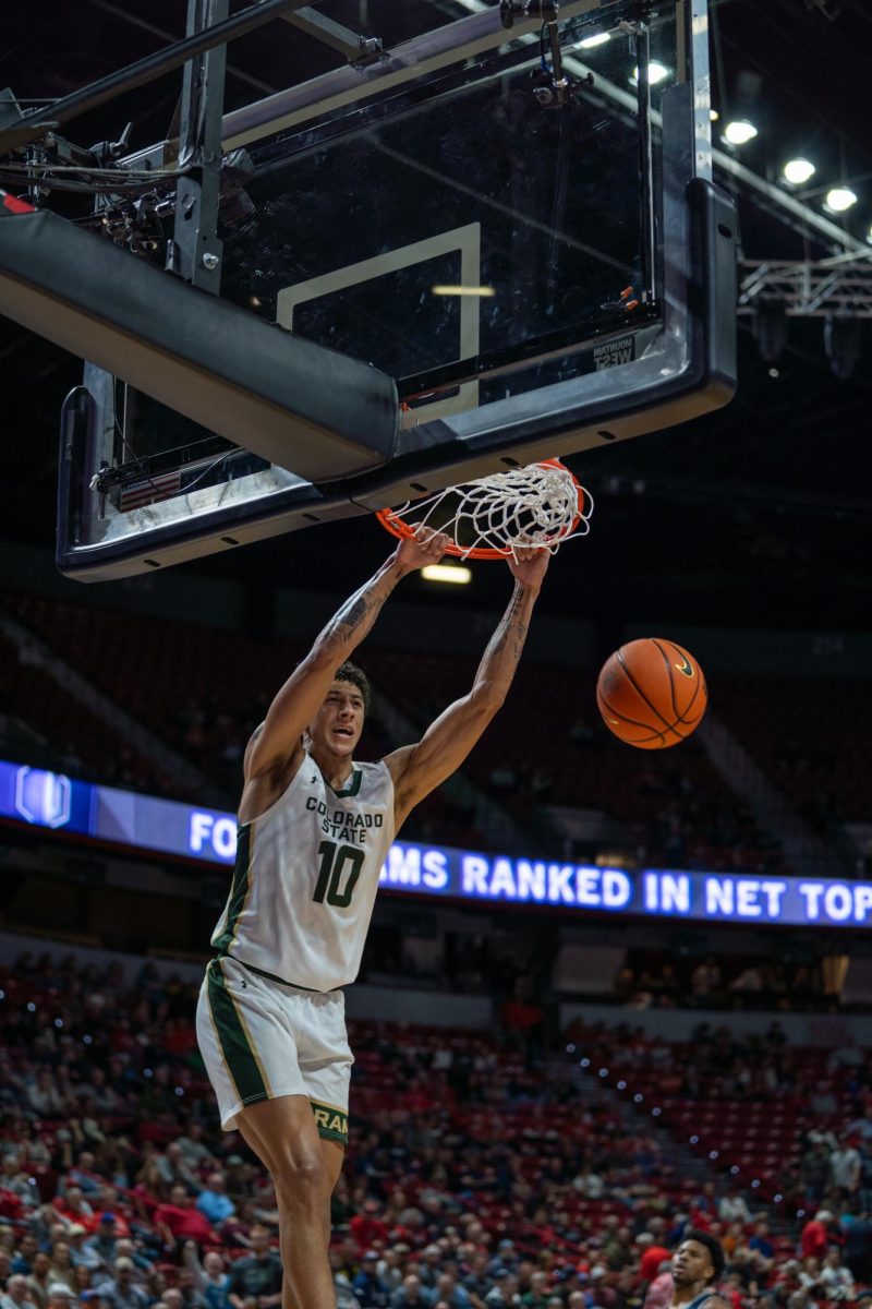 Nique Clifford dunking the ball in the semifinal game of the Mountain West Tournament, Colorado State University took on Utah State March 13. CSU won 