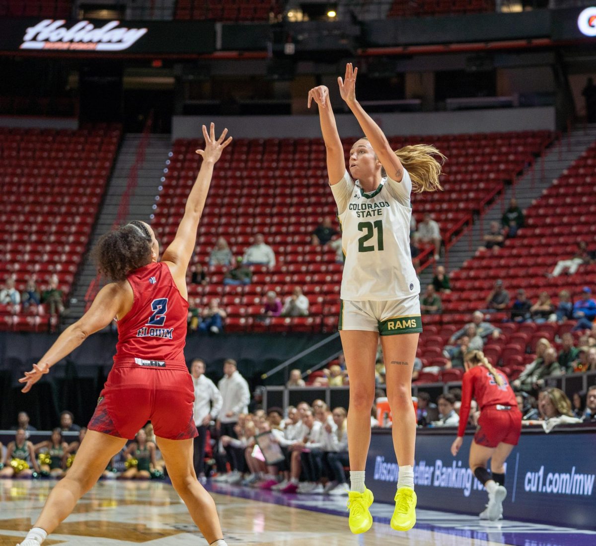 Emma Ronsiek (21) shoots a three-pointer against Fresno State. Colorado State University played Fresno State in the Mountain West tournament quarterfinals March 10. CSU lost 54-52.