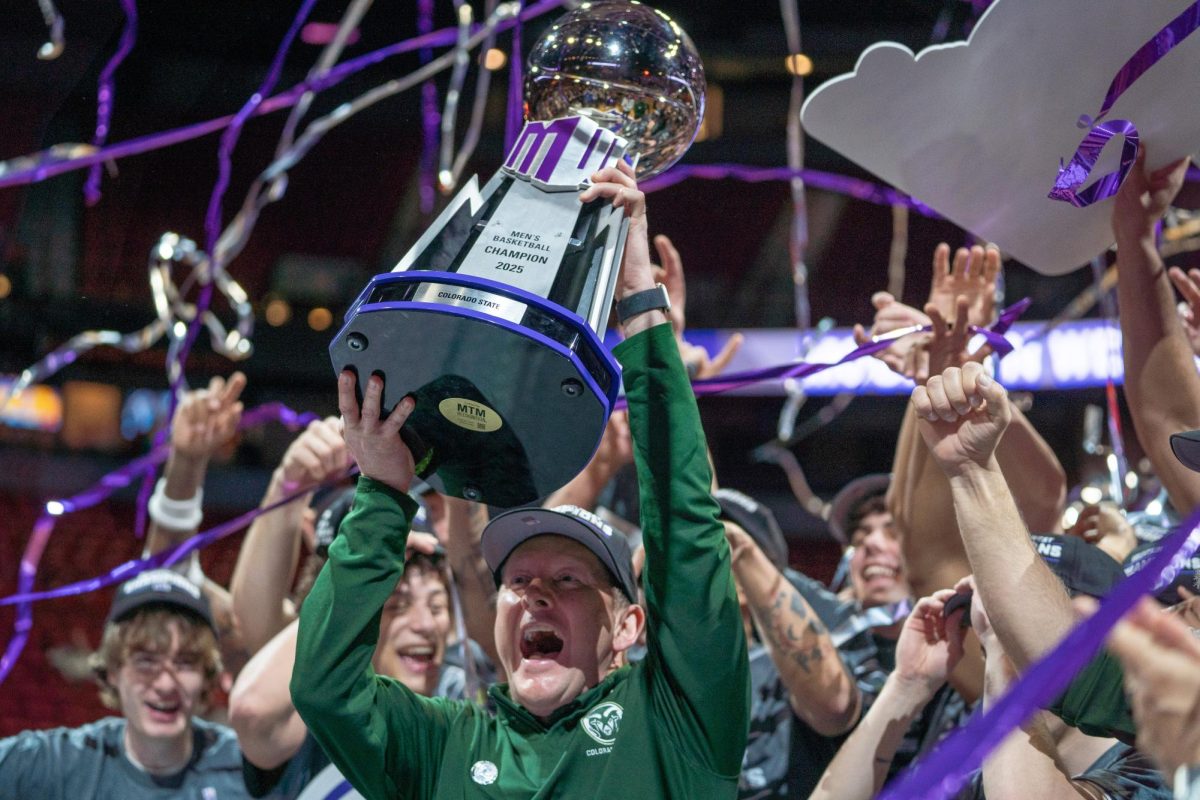 Coach Niko Medved and CSU men's basketball celebrate after claiming the first MW championship in 22 years. Colorado State University defeated Boise State in the title game 69-56 March 15.