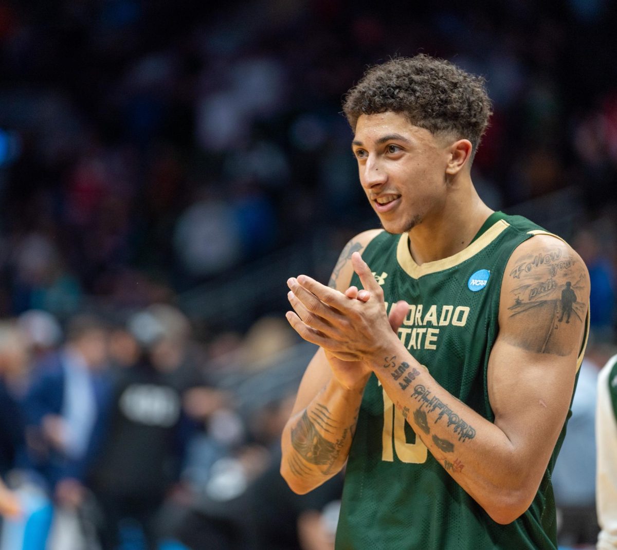 Nique Clifford (10) takes a moment to celebrate his team during Colorado State University's NCAA first-round matchup against the University of Memphis March 21. CSU won 78-70.