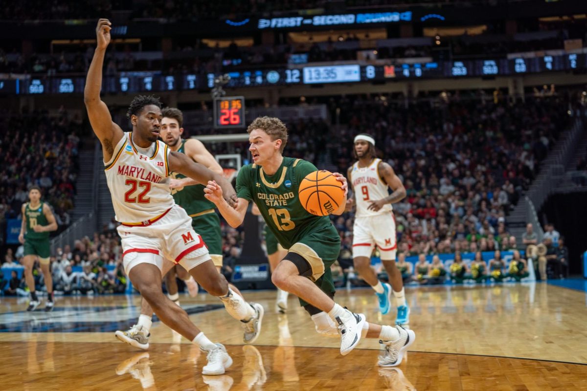 Bowen Born (13) drives to the rim in Colorado State University's NCAA second-round game against Maryland March 23. 