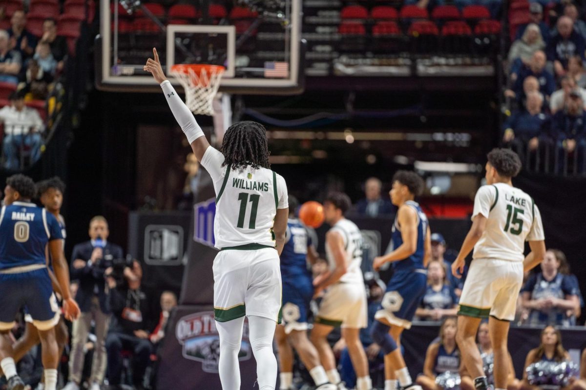 Keshawn Williams (11) celebrates as he catches up with his team in Colorado State University's men's baskektball's MW quarterfinals game against Nevada March 13. CSU won 67-59.