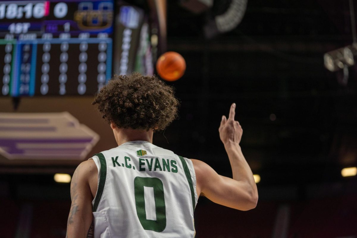 Kyan Evans (0) motions upwards in Colorado State University's MW semifinals game against Utah State Friday. CSU won 83-72 and advanced to the championship round.