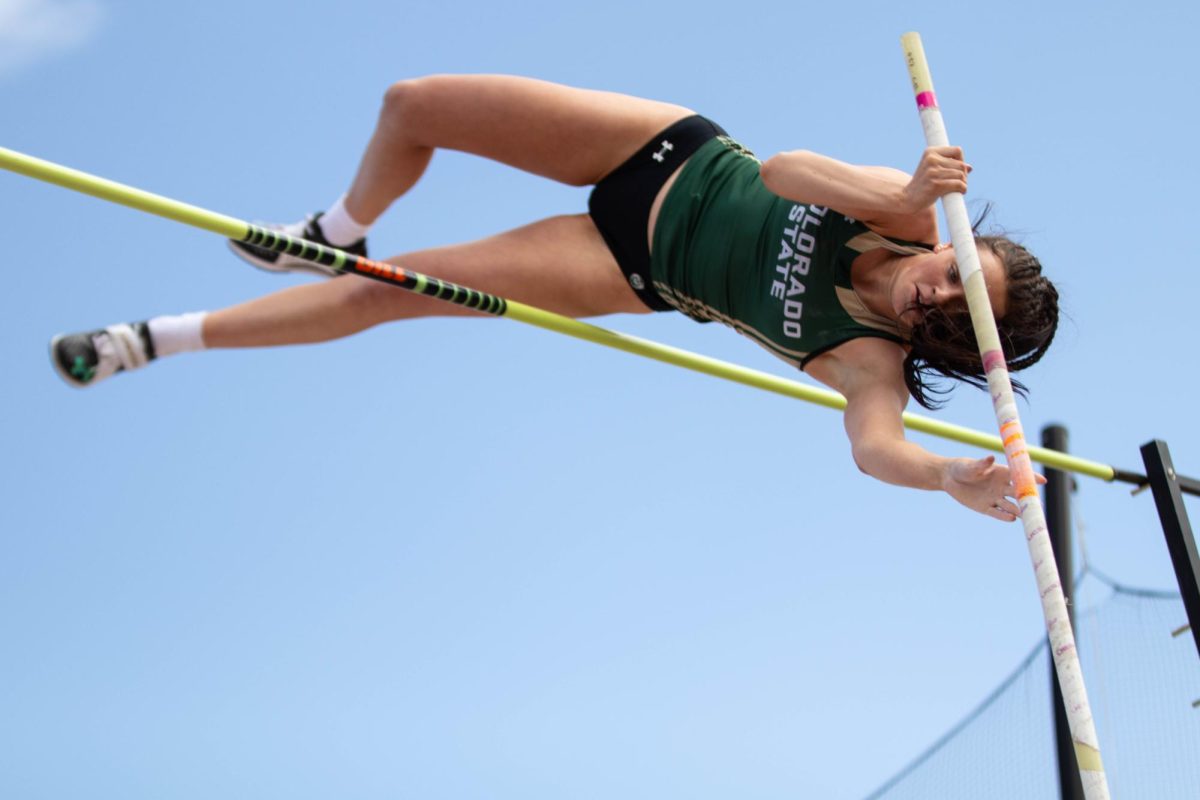 Emily Adams bends over the bar during the pole vault event at the Jack Christiansen Invitational in Fort Collins March 29.