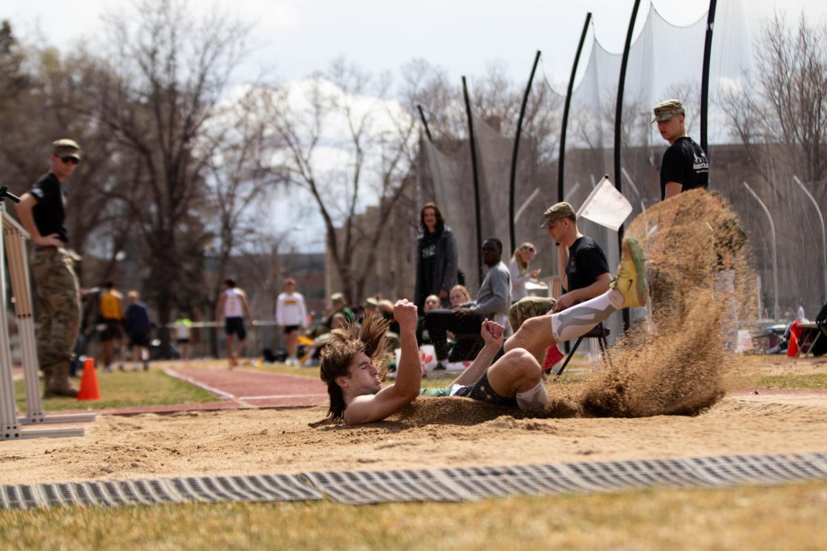 Colorado State University jumper lands in the sand during the long jump event  at the Jack Christiansen Invitational at Colorado State University in Fort Collins Colorado on March 29. Photo taken by Erica Pickering.