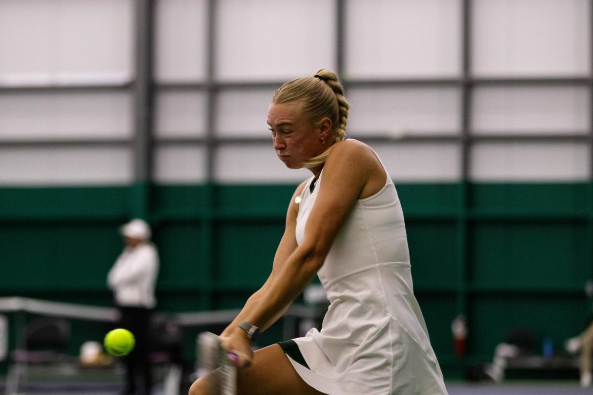 Sarah Weekley hits the ball back to oppenent during match against San Diego State University on March 30 at the Fort Collins Country Club in Fort Collins Colorado. Photo taken by Erica Pickering.