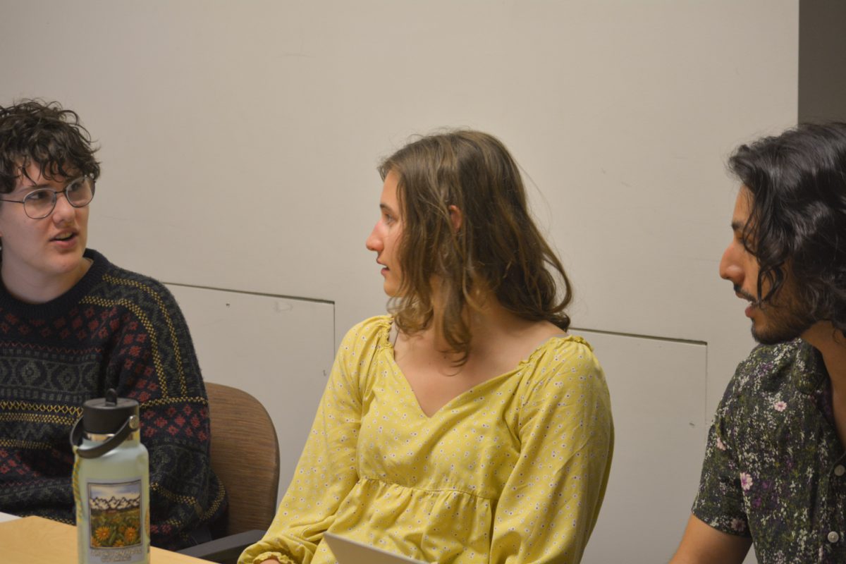 Mia VonLunen and Aden Valdez listening to Jay Mario Bates Domenech speak at the Restorative Justice meeting April 8. This meeting was held at the Behavioral Science building. 