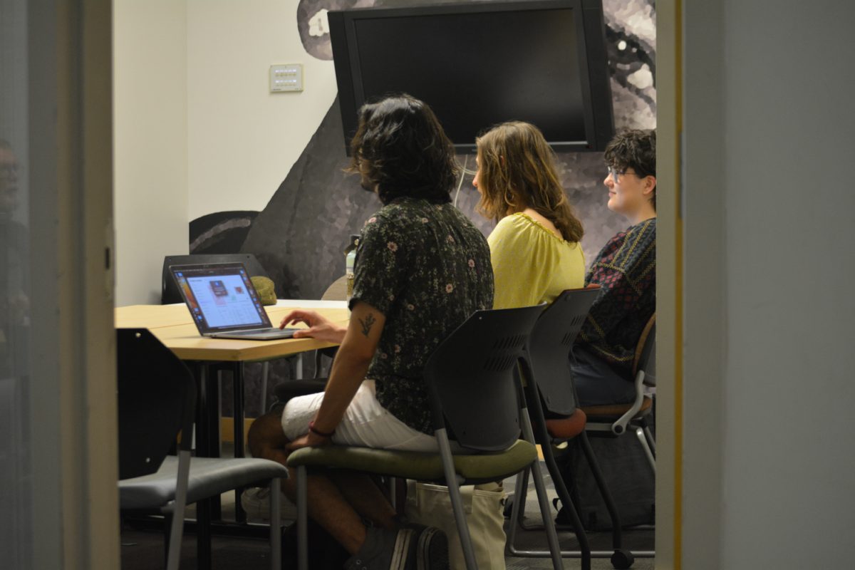 Jay Bates Domenech, Mia VonLunen and Aden Valdez attend the Colorado State University Restorative Justice club meeting April 8. This meeting was at the Behavioral Science building.