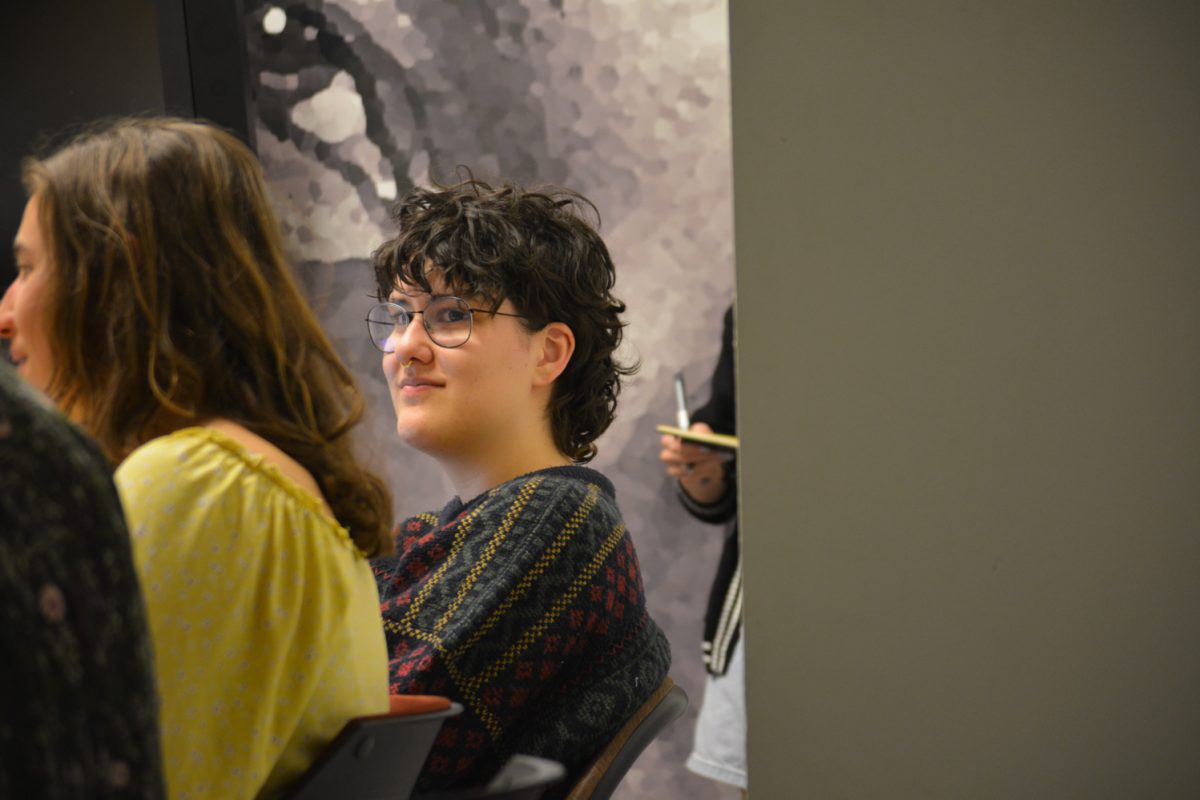 Jay Mario Bates Domenech listening to Mia VonLunen speak during their club meeting April 8. This club is called the Restorative Justice club.