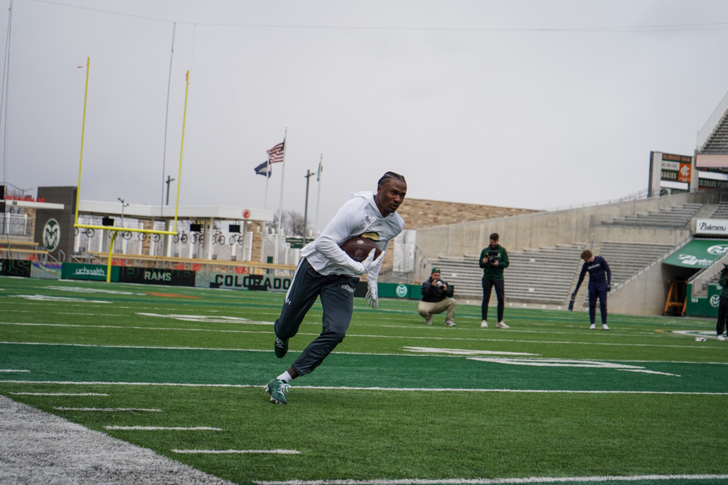 Tory Horton (14) runs routes in front of National Football League scouts April 4.