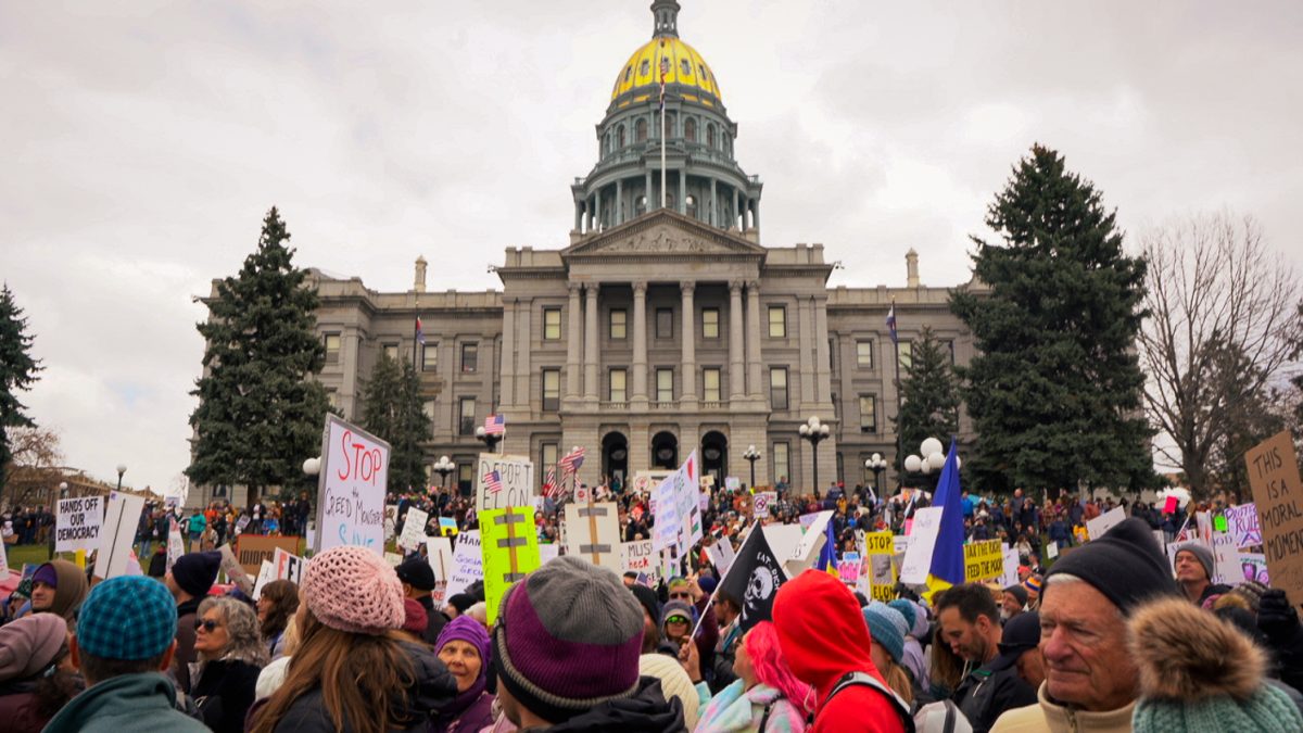 Thousands of demonstrators gather in Civic Center Park in front of the Colorado State Capitol Building during a "Hands Off” protest in Denver Saturday, April 5.